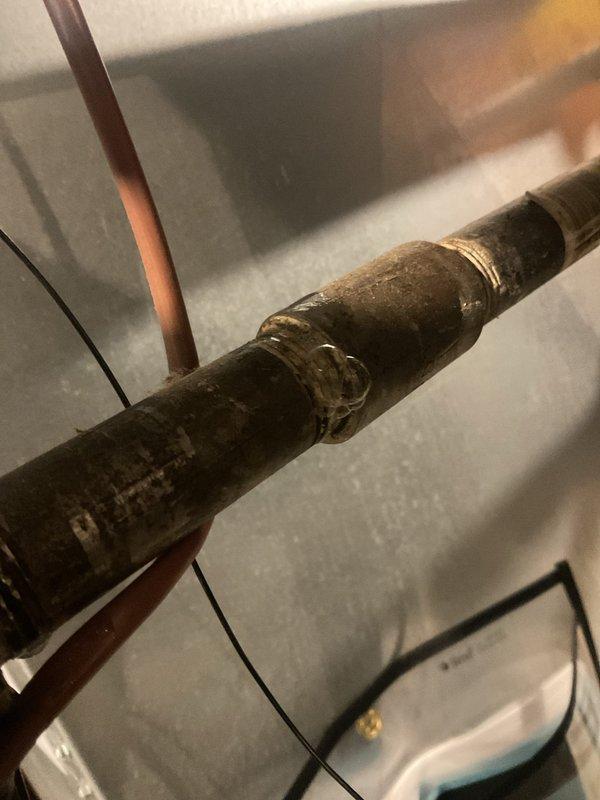 Responded to reported faint gas smell from furnace. Performed comprehensive gas leak detection using calibrated electronic detector throughout unit and associated gas piping connections. Inspected all gas line fittings, including compression coupling on supply line and connections at furnace manifold. No active gas leaks detected during testing. Verified proper operation of all safety controls and documented findings with photographic evidence. Unit operating within normal parameters at time of inspection.