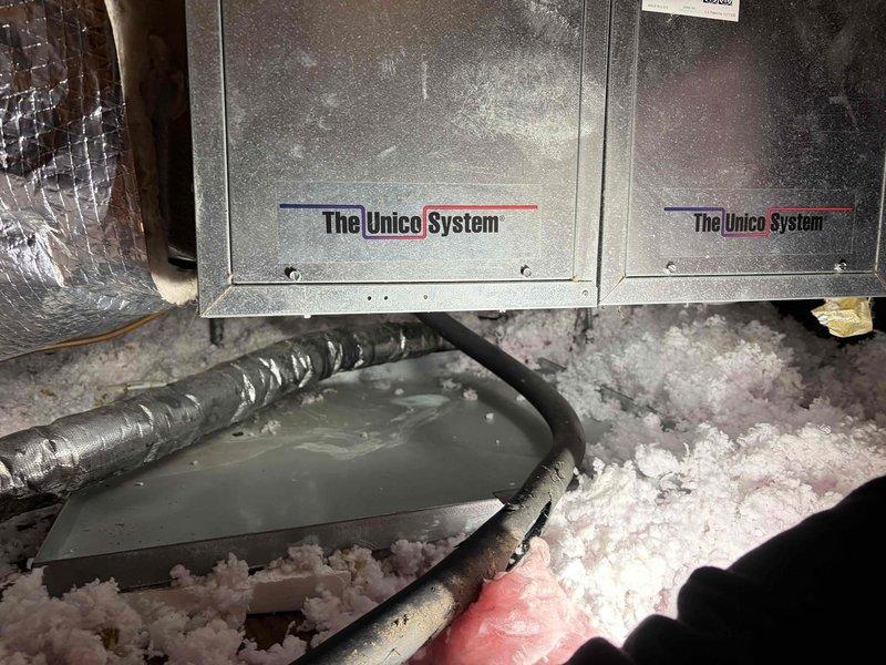 Conducted free estimate for replacement of residential air conditioning system exceeding 16 years of age. Evaluated existing Unico high velocity HVAC system installed in attic space with dual metallic air handler units mounted above blown-in fiberglass insulation. Inspected insulated flex ductwork, condensate drain line routing, and overall system configuration. Assessed ceiling-mounted supply registers with filter access panels. Documented current equipment condition and installation layout through photographs to support replacement system proposal. Provided homeowner with recommendations for new high-efficiency cooling system options suitable for the property's existing high velocity ductwork infrastructure.