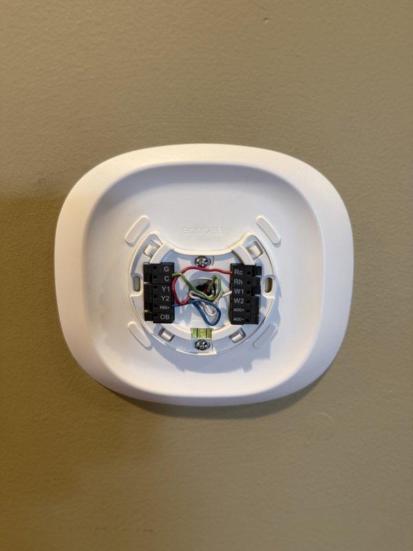 Performed comprehensive inspection of HVAC and plumbing systems at residential property prior to closing. Replaced existing thermostat with new Ecobee3 smart thermostat, completing all necessary wiring connections to terminal block including Y1, Y2, OB, Rc, Rh, W1, W2, and AOC terminals, and verified proper installation and system communication with furnace control board.
