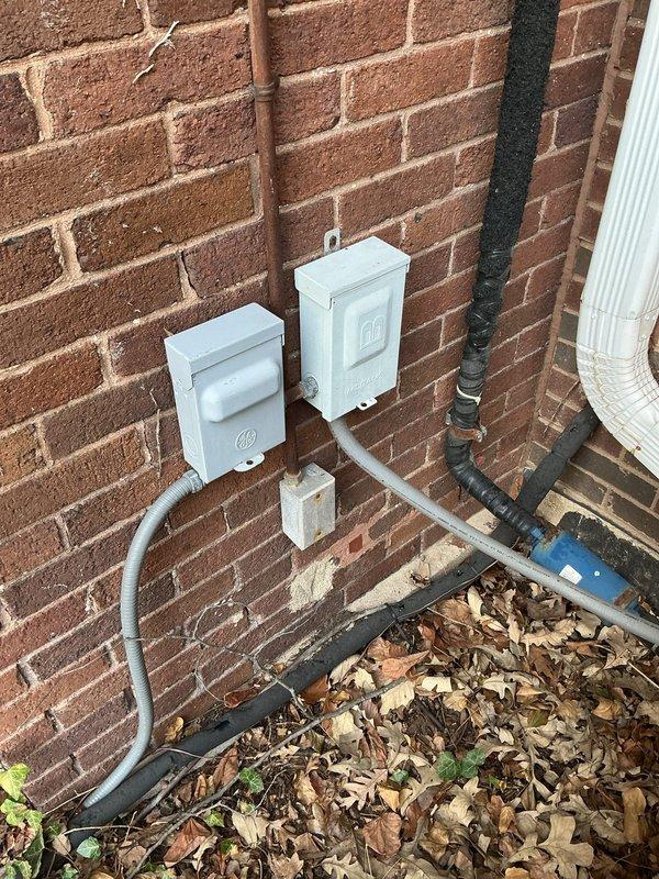 Completed comprehensive maintenance inspection and cleaning on two outdoor air conditioning units under preventative maintenance agreement. Performed standard tune-up procedures including condenser coil cleaning, refrigerant level verification, electrical connection inspection, and system performance testing on both units. Documented equipment conditions with photographic records showing exterior condensing unit installations and interior furnace/air handler components for maintenance history files.