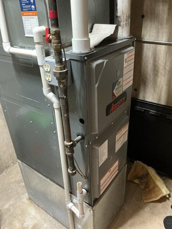 Completed comprehensive maintenance inspection and cleaning on two outdoor air conditioning units under preventative maintenance agreement. Performed standard tune-up procedures including condenser coil cleaning, refrigerant level verification, electrical connection inspection, and system performance testing on both units. Documented equipment conditions with photographic records showing exterior condensing unit installations and interior furnace/air handler components for maintenance history files.