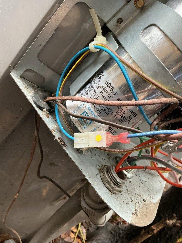 Completed comprehensive maintenance agreement service on two condenser units. Inspected electrical components including capacitor and wiring connections, verifying all connections were secure and properly terminated with wire nuts. Examined attic ductwork system with reflective insulation and confirmed proper installation and routing of electrical wiring throughout the system. All equipment found to be operating within normal parameters with components showing typical age-related wear but functioning correctly.