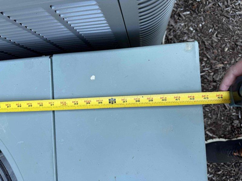 Conducted comprehensive assessment of existing HVAC system for heating unit replacement at residential property. Evaluated current Rheem furnace installation located in basement utility area alongside water heater. Performed dimensional measurements of outdoor air conditioning equipment to ensure proper sizing compatibility for new system installation. Documented existing equipment configuration including PVC venting, copper refrigerant lines, and current furnace placement within confined utility space.

Prepared detailed replacement estimate for two heating units with equipment options. Presented GOOD tier Carrier gas furnace option rated at up to 80% nominal AFUE efficiency and BEST tier Carrier gas furnace option also rated at up to 80% nominal AFUE efficiency. Reviewed existing utility room layout constraints including carpeted flooring, adjacent cabinetry, and current piping configurations to determine installation requirements. Assessed venting pathways and utility connections fo