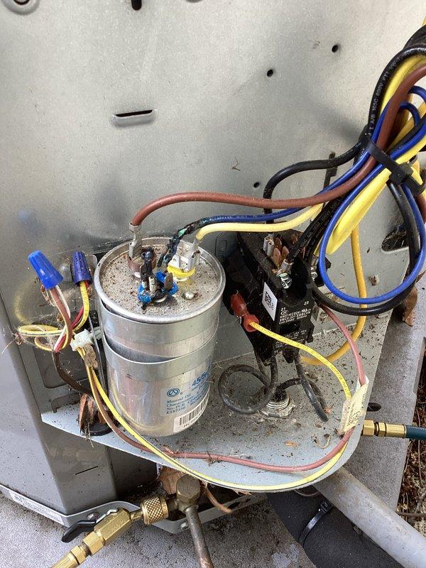 Responded to emergency no-cool call and performed diagnostic evaluation of residential split system air conditioning unit. Upon inspection, found outdoor condenser unit operational with fan running and compressor attempting to start. Accessed electrical compartment and identified failed dual run capacitor as root cause of cooling failure. Capacitor tested below acceptable microfarad range and showed visible signs of deterioration. Removed defective capacitor and installed new dual run capacitor with proper microfarad rating for both compressor and condenser fan motor. Verified all electrical connections secure and properly terminated. Tested system operation and confirmed compressor startup, proper amp draw, and normal cooling cycle restoration. System returned to full operational status with adequate airflow and temperature differential across evaporator coil.