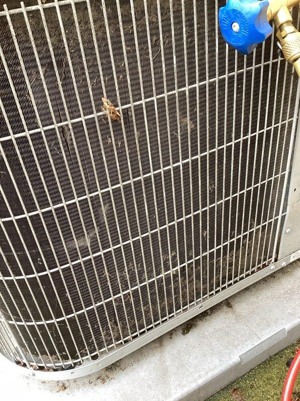 Responded to emergency no-cool call and performed diagnostic evaluation of residential split system air conditioning unit. Upon inspection, found outdoor condenser unit operational with fan running and compressor attempting to start. Accessed electrical compartment and identified failed dual run capacitor as root cause of cooling failure. Capacitor tested below acceptable microfarad range and showed visible signs of deterioration. Removed defective capacitor and installed new dual run capacitor with proper microfarad rating for both compressor and condenser fan motor. Verified all electrical connections secure and properly terminated. Tested system operation and confirmed compressor startup, proper amp draw, and normal cooling cycle restoration. System returned to full operational status with adequate airflow and temperature differential across evaporator coil.