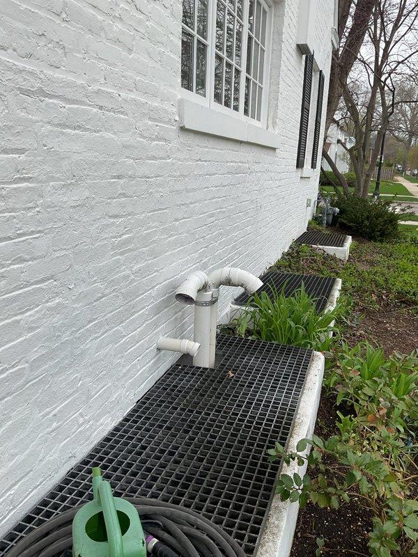 Installed new 50-gallon tanked water heater with expansion tank at residential property. Properly configured exterior PVC venting system along foundation, securing all pipes to building exterior with appropriate mounting hardware and ensuring proper clearances per manufacturer specifications and local code requirements.