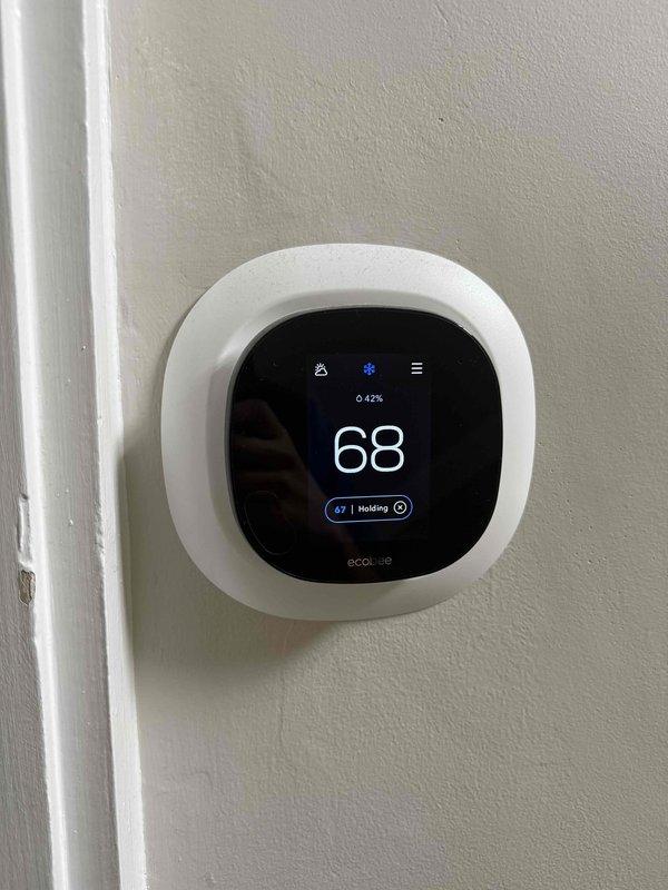 Completed comprehensive cooling check on two air conditioning systems and air handlers as part of general maintenance service agreement. Inspected ecobee smart thermostat displaying proper operation at 68 degrees in heating mode, verified attic-mounted air handler unit and ductwork installation, confirmed all equipment operating within normal parameters with no deficiencies noted.