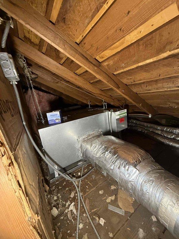 Completed comprehensive cooling check on two air conditioning systems and air handlers as part of general maintenance service agreement. Inspected ecobee smart thermostat displaying proper operation at 68 degrees in heating mode, verified attic-mounted air handler unit and ductwork installation, confirmed all equipment operating within normal parameters with no deficiencies noted.