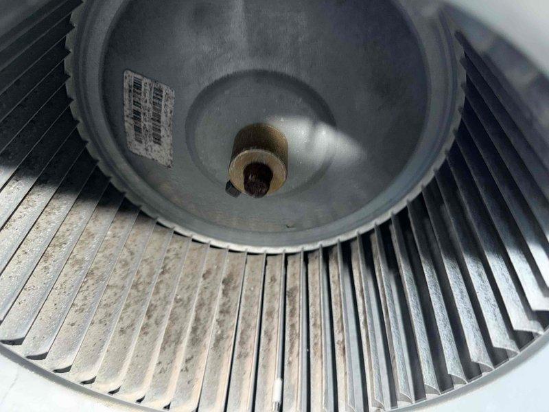 Completed preventative maintenance inspection on rooftop cooling unit as part of service agreement. Inspected blower wheel assembly and motor, noting normal dust accumulation on blades consistent with operational use. Examined air filtration components including protective mesh screening, confirming all components in serviceable condition with no immediate repairs required.