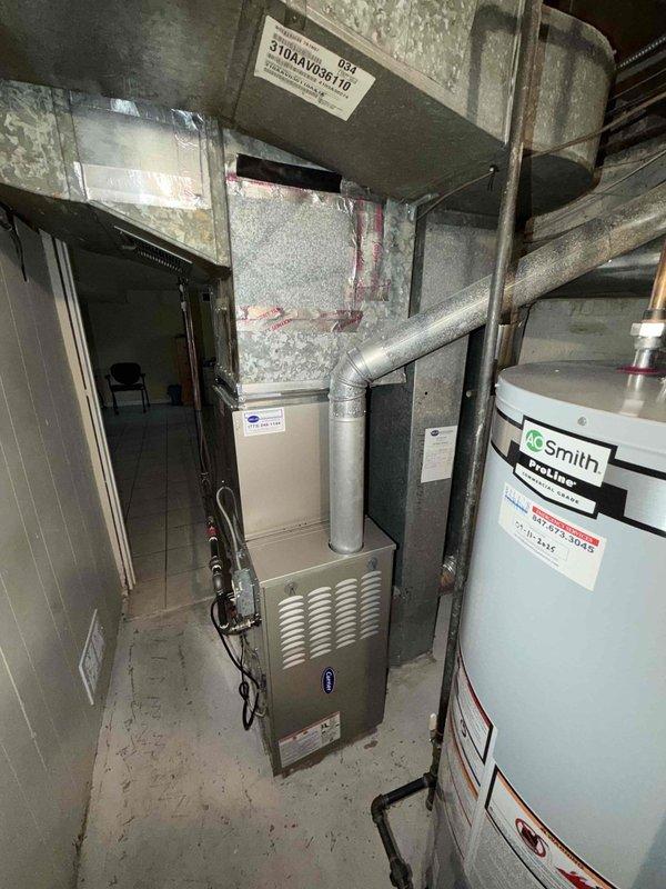Completed preventive maintenance agreement inspection on residential HVAC system including indoor furnace unit and outdoor condenser compressor. Performed visual assessment of equipment condition, refrigerant line connections, electrical components, and mounting platforms. Documented current system status with photos showing operational equipment, copper line configurations, and installation environment for maintenance records.