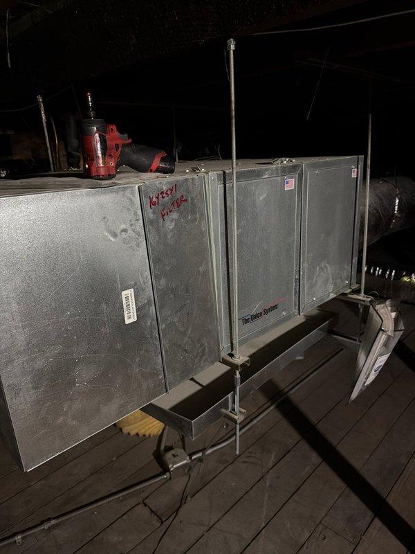 Performed comprehensive cleaning and maintenance on two air conditioning systems and air handlers following construction activity that resulted in heavy dust accumulation throughout the HVAC equipment. Replaced two 16x20x1 disposable filters and cleaned one washable filter, all of which showed significant construction debris buildup. Conducted thorough inspection of attic-mounted Trane air handler unit, removing accumulated dust and particulate matter from exterior surfaces and accessible components. 

Additionally, inspected boiler and radiator heating system in response to recent radiator installation work and customer concern regarding potential water leak near floor level. Evaluated piping connections, radiator installations, and surrounding areas to determine source of moisture and assess whether discharge was intentional drainage by design or unintended leak requiring repair. Documented equipment conditions through photography for service records.