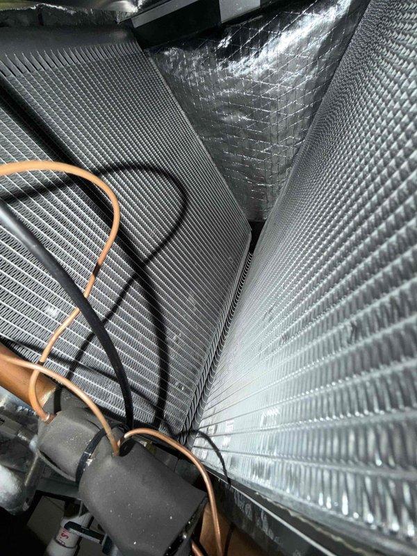 Completed comprehensive tune-up and inspection on residential air conditioning system. Performed standard maintenance procedures including inspection of indoor evaporator coil assembly, verified proper refrigerant line insulation, checked electrical connections and components at service panel and disconnect box, and confirmed all system components were operating within normal parameters. Unit found to be in good working condition with no immediate repairs required.