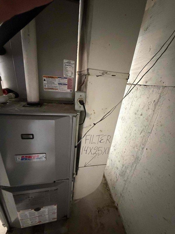 Completed comprehensive furnace replacement estimate for a 20-year-old HVAC system located in basement utility area with easy access. Evaluated existing gray metal furnace unit and assessed current installation including associated ductwork, PVC venting system, and electrical connections to determine feasibility of replacement versus continued repairs given the age and condition of the equipment.
