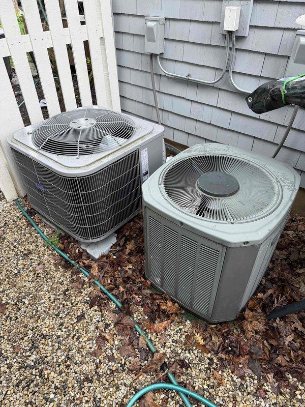 Conducted comprehensive HVAC system evaluation for residential property with aging 25-30 year old equipment requiring replacement. Assessed existing dual outdoor condenser units and indoor components, documented current Honeywell Home smart thermostat, and photographed equipment conditions to provide accurate replacement estimate for new air conditioning unit and heat exchanger system.