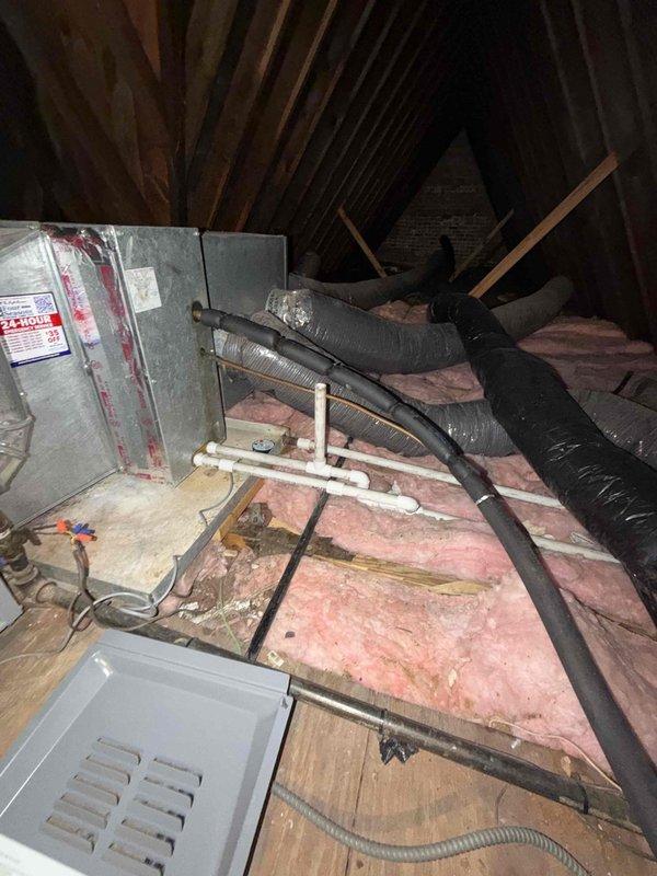 Conducted onsite inspection of existing attic-mounted HVAC system to assess replacement requirements. Evaluated current air handler unit, flexible ductwork configuration, and associated drainage systems including PVC condensate lines. Documented equipment condition, noting aged installation with disturbed insulation and existing duct connections. Photographed attic installation layout including equipment positioning, ductwork routing, electrical connections, and clearance requirements for replacement planning. Provided comprehensive free estimate for complete AC unit replacement based on inspection findings.