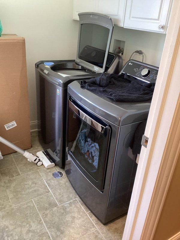 Completed comprehensive whole home plumbing inspection examining all accessible fixtures, supply lines, drain systems, and connections throughout the property. Inspected bathroom sink plumbing including chrome-plated supply lines with braided flexible hoses, shut-off valves, and white PVC P-trap configuration, confirming proper installation and absence of leaks. Evaluated laundry room plumbing connections for washing machine and dryer, checking drainage components and supply line integrity. All photographed areas showed proper plumbing installation with no visible defects or immediate concerns requiring repair.