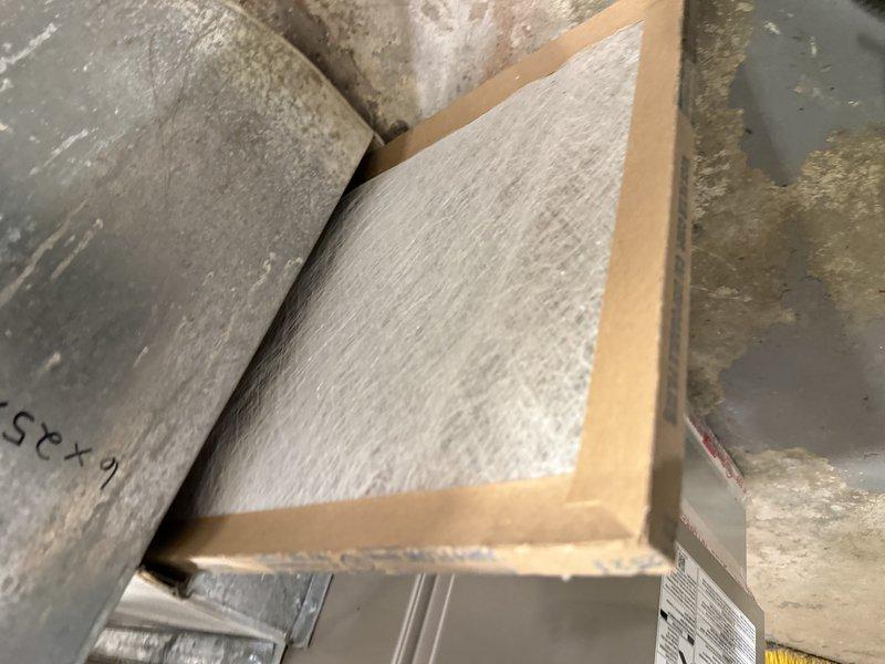Responded to no cooling complaint on 6-year-old AC unit located in backyard. Upon arrival, inspected outdoor condensing unit and verified power supply at deck-mounted electrical outlet box. Accessed attic space and examined supply ductwork and air distribution system, noting 25x4 filter dimensions and confirming proper insulation on main supply trunks. System evaluated for electrical connectivity, airflow restrictions, and mechanical operation to diagnose cooling failure.