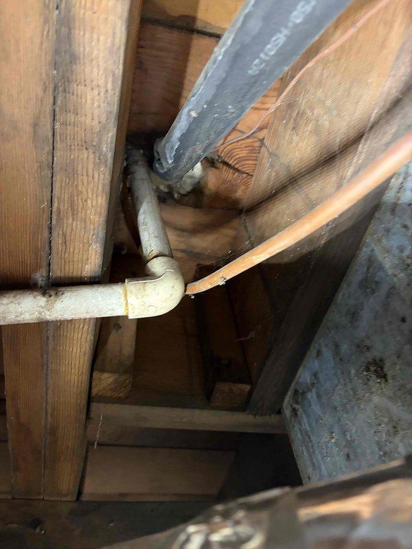Conducted on-site evaluation of existing cooling system for replacement estimate. Assessed outdoor condensing unit mounted on concrete pad against exterior brick wall, documenting current equipment condition, electrical connections including disconnect switch and junction boxes, and proper clearances. Inspected attic space to evaluate ductwork routing, structural access points, and existing PVC condensate drain line installation to determine requirements for new system installation and any necessary modifications to accommodate replacement equipment.