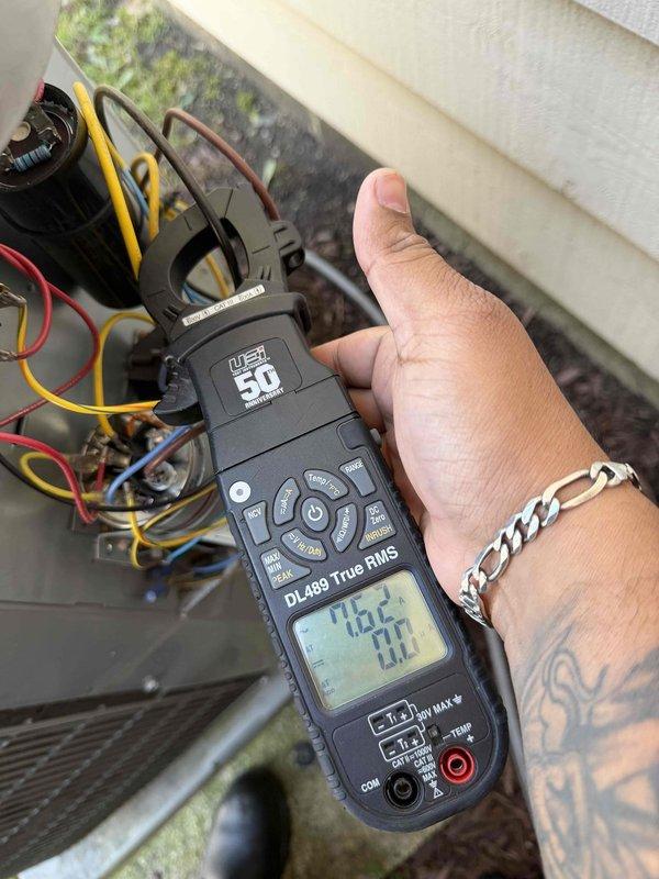 Performed routine maintenance on residential air conditioning system under service agreement. Changed out 16x25x1 filter and conducted system diagnostics, including electrical readings on compressor unit showing 140.2V and 81.1A, and static pressure measurements at ductwork junction reading 93.73, confirming proper system operation and airflow.