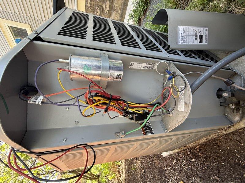 Completed cooling cycle air conditioning general service maintenance per agreement terms. Verified thermostat operation displaying 89°F and proper communication with HVAC system. Inspected outdoor condensing unit with cover removed, checked all electrical connections, capacitor condition, and compressor motor components. All wiring connections secure with proper color coding intact, capacitor tested within specifications, and unit operating normally with no deficiencies noted.