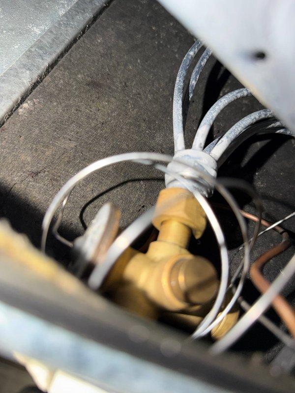 Completed comprehensive cooling maintenance and inspection per agreement terms. Performed thorough examination of refrigerant line connections, electrical wiring, and control board components. Documented system condition with detailed photographs showing brass valve fittings, refrigerant lines, and control panel internals. All electrical connections, capacitors, and circuit board components inspected and found operational. System tested and verified functioning within normal parameters.