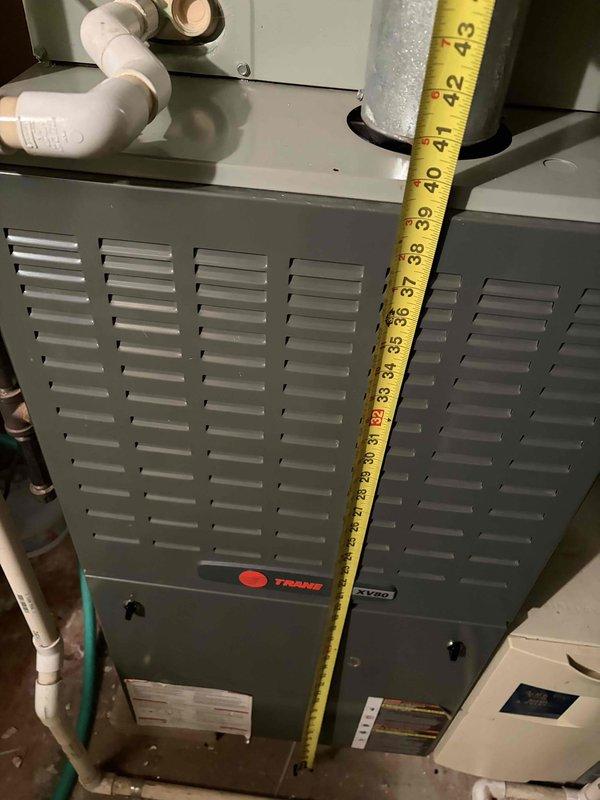 Completed comprehensive assessment of two complete HVAC systems, both 22 years old and operating with obsolete R22 refrigerant. Documented existing Trane furnace unit with integrated ventilation system and Aprilaire Media Air Cleaner Model 2400. Both air conditioning systems have reached end of serviceable life due to phased-out refrigerant and age-related obsolescence. Recommended complete replacement of both full systems to restore reliable climate control and improve energy efficiency.