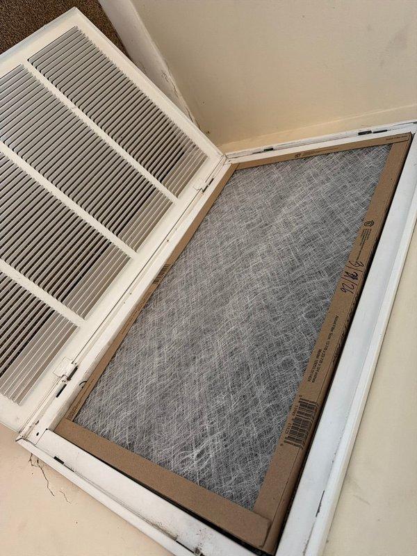 Completed AC tune-up on outdoor unit located in patio closet with indoor air handler. Inspected air return vent and filter, which customer maintains regularly. Performed comprehensive system inspection including electrical components, capacitors, pressure gauges, blower motor assembly, and all wiring connections. Documented system condition with photos showing filter status and internal components in functional condition with normal dust accumulation.