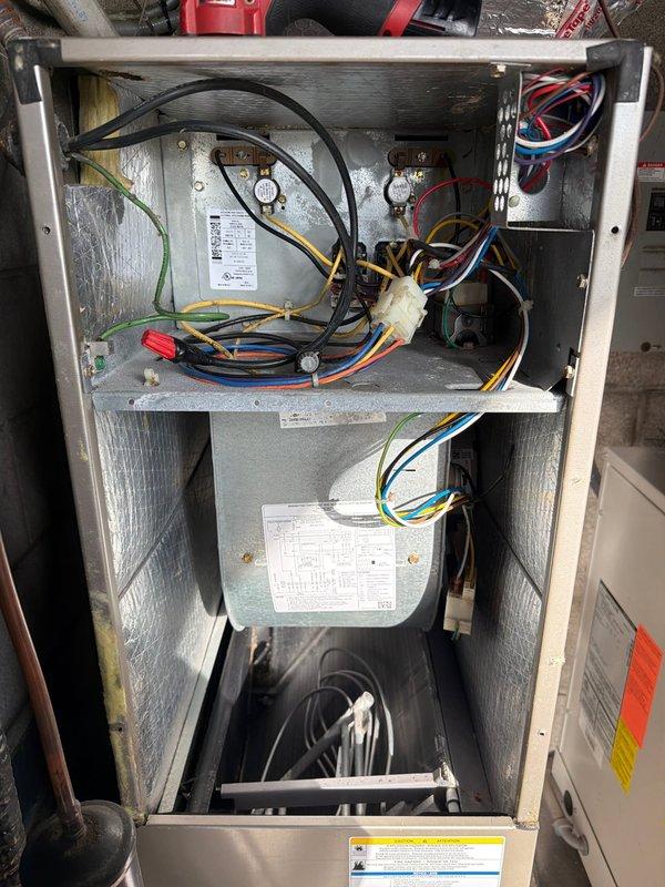 Completed AC tune-up on outdoor unit located in patio closet with indoor air handler. Inspected air return vent and filter, which customer maintains regularly. Performed comprehensive system inspection including electrical components, capacitors, pressure gauges, blower motor assembly, and all wiring connections. Documented system condition with photos showing filter status and internal components in functional condition with normal dust accumulation.