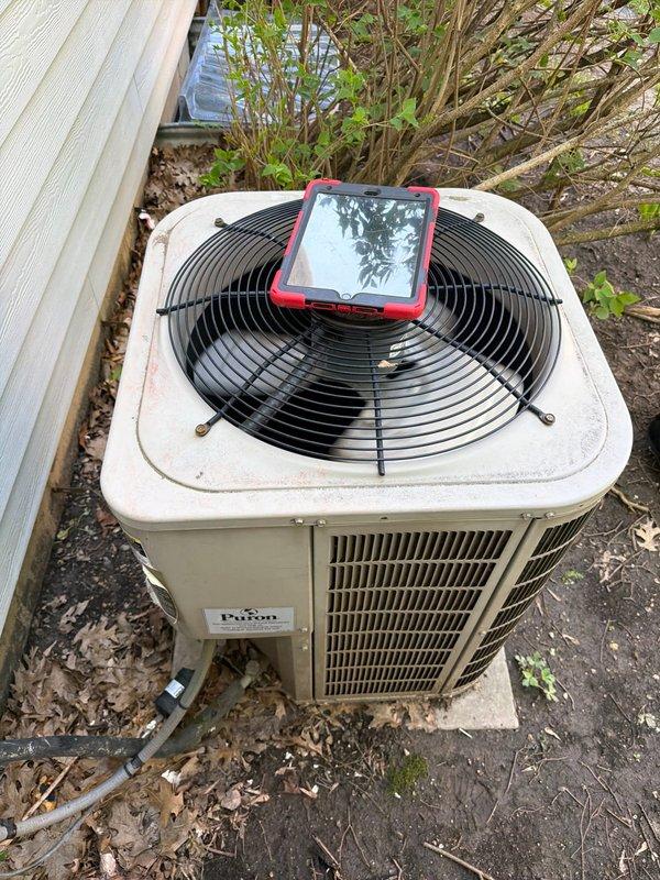 Completed preventive maintenance inspection on Payne condensing unit as part of agreement service. Documented extensive mold and mildew growth in air handler interior corner indicating moisture infiltration and condensation issues requiring attention. Verified condenser operation and captured equipment condition photos for service records.