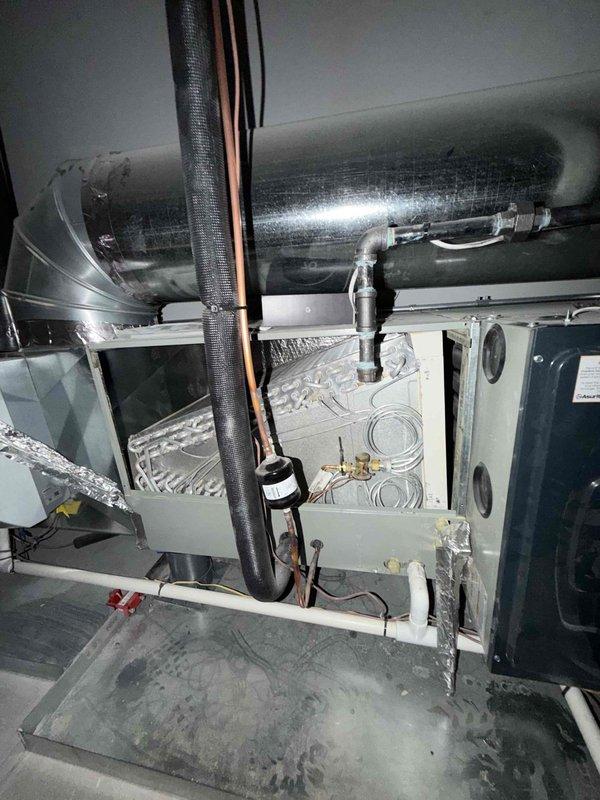 Performed preventative maintenance agreement service on residential HVAC system including two condenser units. Completed comprehensive system inspection of air handler, ductwork, refrigerant lines, and associated components located in mechanical room and attic space. All equipment found operating within normal parameters, no media replacement required during this scheduled maintenance visit.