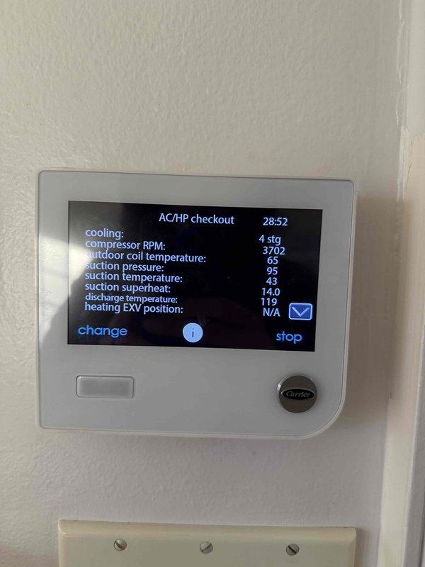 Responded to callback for 2-year-old Carrier AC/HP system displaying error messages and suspected frozen coil condition. Upon arrival, performed diagnostic checkout using thermostat's built-in system test mode to verify operational parameters including temperature differentials, pressures, and staging functions. Measured supply air temperature at 50.3°F using calibrated digital thermometer at plenum to confirm proper cooling operation and rule out frozen evaporator coil. Verified system pressures reading 14.0 PSI with discharge temperature at 119°F and return air at 65°F, all within normal operating range. Cleared error codes and confirmed unit cycling properly through all stages without fault conditions present.