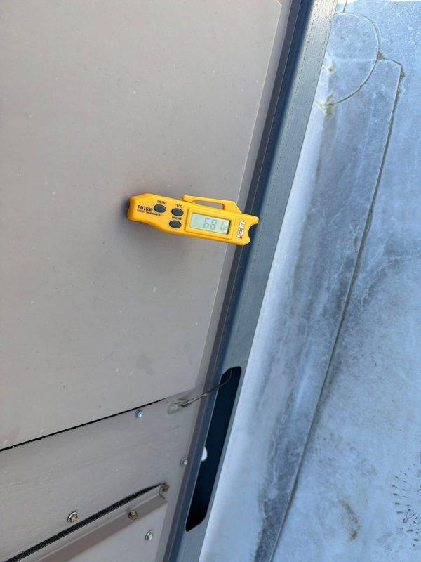 Responded to no cooling complaint on rooftop unit. Upon arrival, found unit blowing warm air. Performed diagnostic temperature measurements at unit access panels, recording readings to verify temperature differential and system performance. Completed call-out-the-window (COTW) service protocol, documenting equipment conditions with field measurements using calibrated digital instrumentation.
