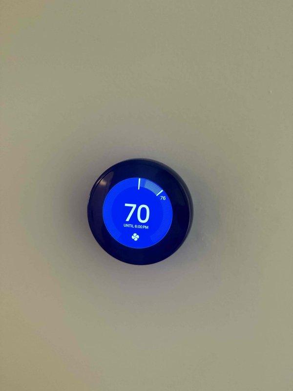 Completed cooling check on two residential air conditioning systems as part of Gold Service agreement. Verified thermostat operation showing proper temperature control set to 70°F cooling mode, inspected upstairs HVAC installation including furnace and Aprilaire air quality equipment with all components and ductwork in good working condition with no visible defects or maintenance concerns noted.