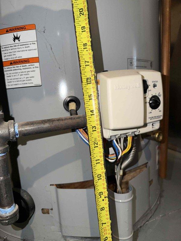 Responded to service call for tanked water heater inspection. Upon arrival, observed rust formation at the bottom of the water heater tank, indicating potential corrosion and possible tank deterioration. Documented equipment measurements and current condition with photographs for service records. Equipment information needs to be added to service tracking system for this new customer account.