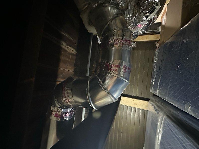Responded to no cooling complaint on 1-year-old residential air conditioning system. Replaced failed fuse in condensing unit to restore power to compressor circuit. Installed additional ductwork run in attic space using rigid galvanized metal duct sections with insulated flex connections. Measured and fitted duct collar transition at branch takeoff point to ensure proper airflow distribution. Secured all ductwork connections and verified system operation with adequate cooling performance restored.