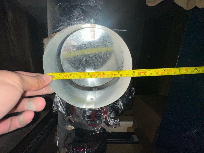 Responded to no cooling complaint on 1-year-old residential air conditioning system. Replaced failed fuse in condensing unit to restore power to compressor circuit. Installed additional ductwork run in attic space using rigid galvanized metal duct sections with insulated flex connections. Measured and fitted duct collar transition at branch takeoff point to ensure proper airflow distribution. Secured all ductwork connections and verified system operation with adequate cooling performance restored.