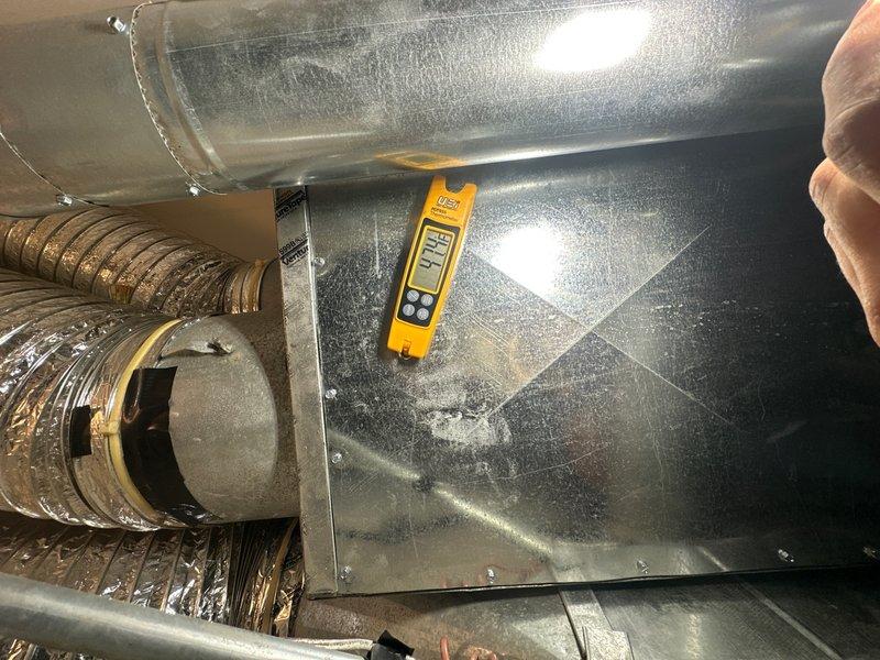 Completed preventive maintenance inspection on residential air conditioning system under maintenance agreement. Performed diagnostic testing of system components including temperature and humidity readings in attic-mounted equipment, verified proper operation of ductwork and plenum connections, and inspected electrical components and safety devices for proper function. All metallic surfaces showed normal condensation consistent with active cooling operation, flexible ductwork and connections found in serviceable condition.