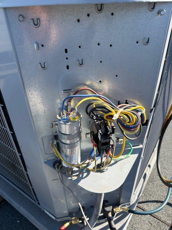 Completed preventive maintenance on rooftop air conditioning system with 16x25x1 air filter replacement. Performed system diagnostics using manifold gauges to verify proper refrigerant pressures and operating conditions. Inspected electrical components including capacitor and contactor, verified all wire connections were secure, and confirmed unit operation. All equipment found to be functioning within normal parameters.