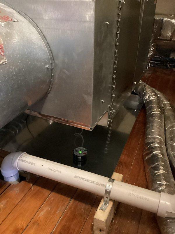 # HVAC Installation Summary

Successfully completed full air conditioning system replacement including outdoor condensing unit, indoor air handler, and evaporator coil. Installation was performed by two-person crew and completed within one day.

# Work Performed

Removed existing outdoor condenser unit and installed new replacement unit with proper refrigerant line connections and electrical hookup. Replaced indoor air handler assembly in attic space, ensuring proper mounting and structural support using chain suspension system. Installed new evaporator coil with appropriate refrigerant line connections.

Configured ductwork connections to air handler using insulated flexible duct with proper sealing. Installed new condensate drain line using PVC piping with appropriate slope and securing brackets to floor joists. Applied reflective radiant barrier insulation around air handler and ductwork to minimize heat transfer in attic environment.

Verified proper airflow and temperature differe