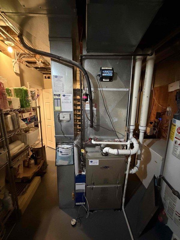 Completed cooling call on two air conditioning systems. Performed general service inspection on both units. Noted 16x25x1 dynamic filter not included in service. Recommended replacement of UV light bulb. Documented equipment conditions with photos showing testing equipment readings and basement mechanical room setup with HVAC equipment, ductwork, and PVC piping.