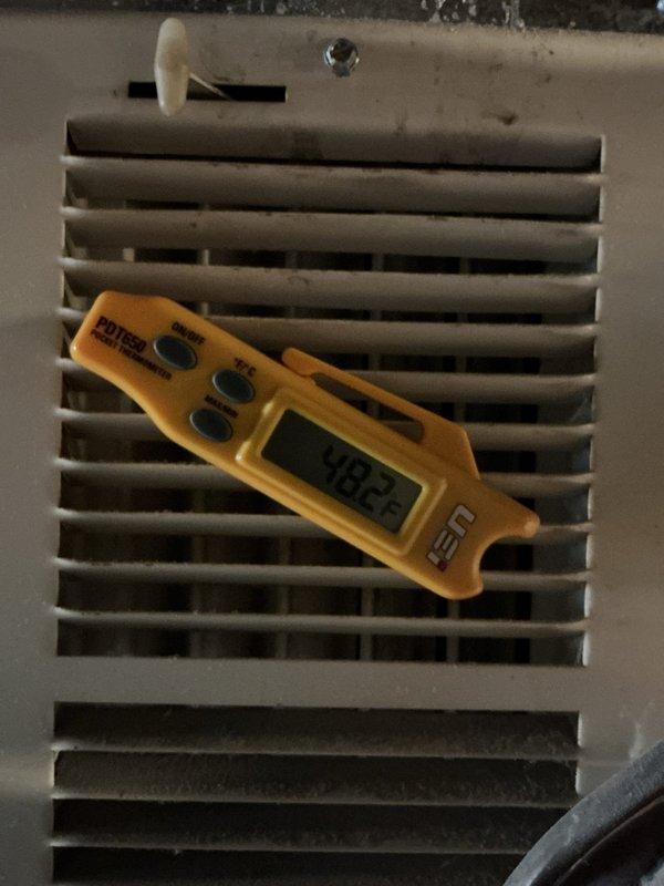 Completed HVAC maintenance agreement inspection on outdoor condensing unit, model 4710E01260, 208-230V system. Performed temperature diagnostics using digital thermometer at supply grille, recording 188.8°F reading. Verified unit nameplate specifications, confirmed proper labeling, and documented equipment condition with no immediate service concerns noted during this scheduled maintenance visit.