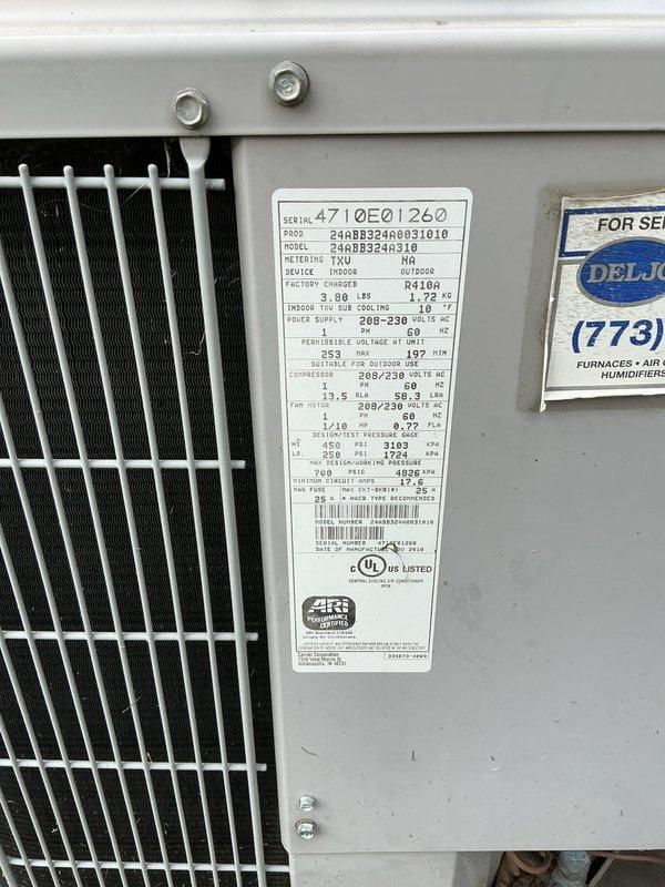 Completed HVAC maintenance agreement inspection on outdoor condensing unit, model 4710E01260, 208-230V system. Performed temperature diagnostics using digital thermometer at supply grille, recording 188.8°F reading. Verified unit nameplate specifications, confirmed proper labeling, and documented equipment condition with no immediate service concerns noted during this scheduled maintenance visit.