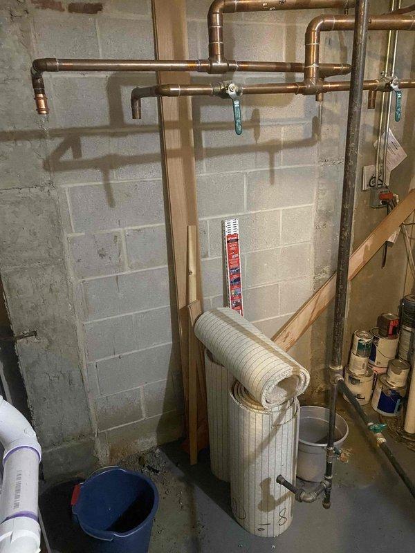 Removed two existing twinned 75-gallon water heaters from service and replaced with new Rheem tanked water heater system. Installed expansion tank to protect against thermal expansion and maintain proper system pressure. Configured copper supply and discharge piping with appropriate brass fittings, dielectric unions, and pressure relief valve assembly. All connections properly secured and tested for leaks. System commissioned and verified operational.
