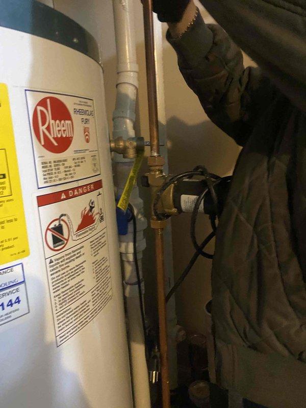 Removed two existing twinned 75-gallon water heaters from service and replaced with new Rheem tanked water heater system. Installed expansion tank to protect against thermal expansion and maintain proper system pressure. Configured copper supply and discharge piping with appropriate brass fittings, dielectric unions, and pressure relief valve assembly. All connections properly secured and tested for leaks. System commissioned and verified operational.