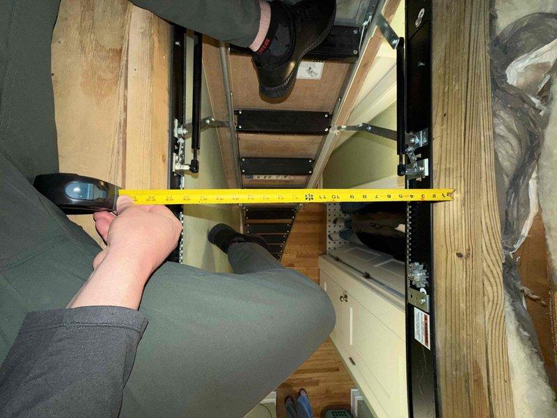 Performed comprehensive estimate for full-system HVAC replacement on second-floor zone serving top level of residence. Existing 22-year-old system located in attic space accessed via pull-down ladder. Documented current equipment dimensions and existing ductwork configuration, including silver flex duct and metallic-wrapped supply runs. Assessed attic conditions, noting Johns Manville insulation installation between rafters and available clearances for new equipment placement. Measured air handler footprint to determine proper sizing and compatibility for replacement unit installation.