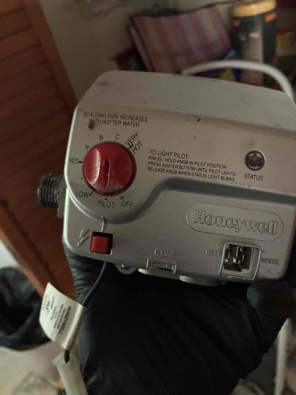 Returned to property to complete installation of Honeywell gas control valve on water heater. Successfully installed replacement valve, restored gas supply, and lit pilot following proper safety procedures. Verified unit achieved proper combustion with stable blue flame pattern visible through viewing port and confirmed water heater returned to normal operation with temperature controls functioning correctly.