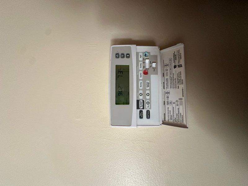 Completed preventive maintenance agreement service on outdoor condensing unit and indoor thermostat system per 14x25x1 filter specification. Inspected condenser coils, refrigerant lines showing normal oxidation patina, compressor operation, and verified thermostat functionality with system operating at 71°F setpoint while ambient measured 82°F. All components found operating within normal parameters with no immediate service requirements identified.