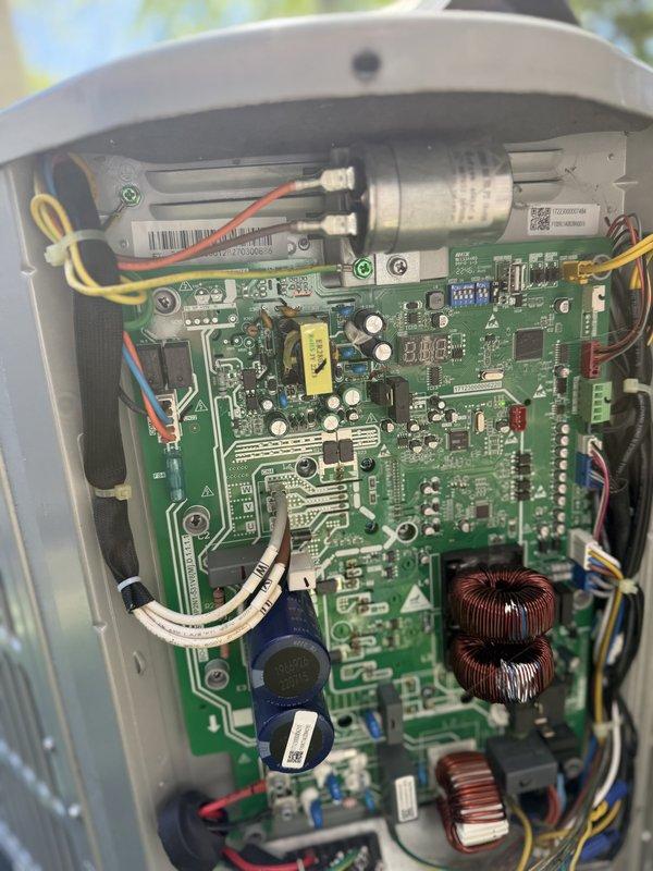 Responded to service call regarding beeping sound from HVAC equipment. Accessed air handling unit in attic space and inspected control board assembly. Located source of audible alarm on electronic control board, which contained multiple toroidal inductors, capacitors, and integrated circuits. Examined all electrical connections, wiring harnesses, and mounted components for proper operation. Verified condensate drain line configuration and checked air handler access panel condition. Addressed beeping issue and confirmed system functionality upon completion of inspection.