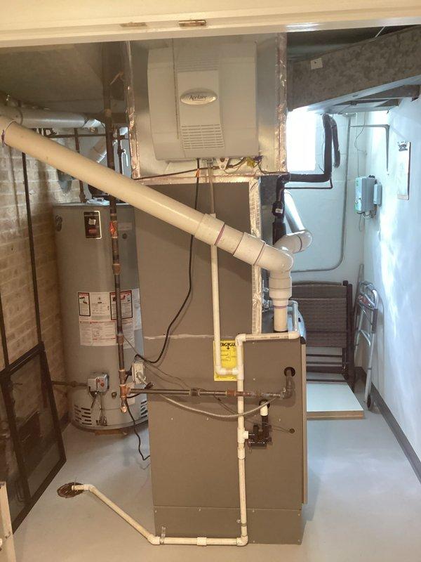 Completed comprehensive air conditioning tune-up and maintenance service. Performed thorough inspection of HVAC system including furnace, ductwork, and Aprilaire humidifier in basement mechanical room. Cleaned blower wheel which had accumulated significant dust and debris buildup, restoring proper airflow and system efficiency.