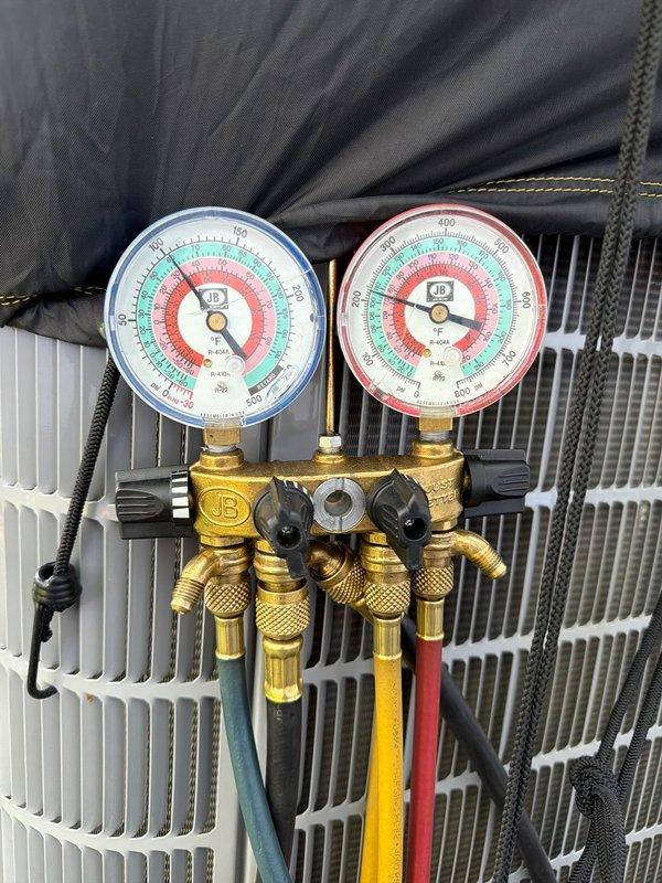Completed preventive maintenance agreement service on single air conditioning system. Connected manifold gauges to measure refrigerant pressures and recorded supply air temperature of 53°F at register, confirming proper system operation and cooling performance within manufacturer specifications.